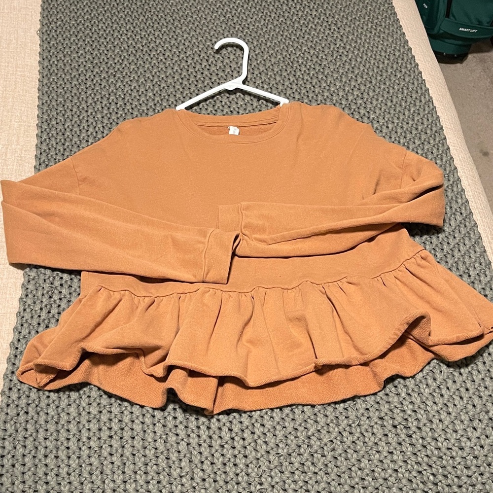 Orange Ruffle Hem Peplum top